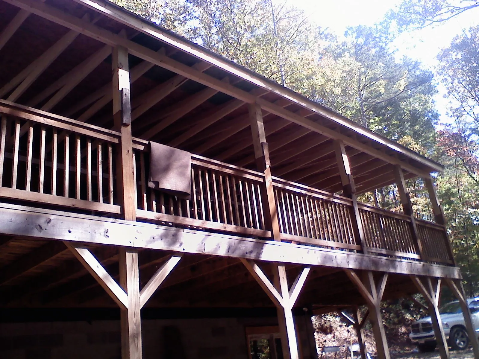 Timber framing under a new elevated porch and deck — Roof Leak Repair in Bozeman by Roofing Brothers